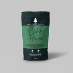 Coffee bag labeled 'Cedar Haven' from Sanctuary Hills on a light gray background