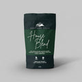 Coffee bag labeled 'House Blend' from Sanctuary Hills on a light gray background