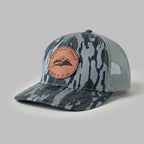 Camouflage-patterned cap with a pink patch on a light gray background